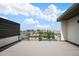Outdoor deck with skyline view, modern railing, and ample space for relaxing and entertaining at 47 Harrison, Denver, CO 80206