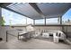 Stylish outdoor patio with pergola, dining table, and comfortable seating area for entertaining at 47 Harrison, Denver, CO 80206