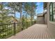 Large wooden deck provides a panoramic view of the surrounding homes and lush greenery at 31139 Tahoe Ct, Evergreen, CO 80439