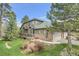 Beautiful home with a stone foundation, attached garage and nicely landscaped yard at 31139 Tahoe Ct, Evergreen, CO 80439