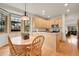 Eat-in kitchen featuring stainless appliances, light wood cabinets, a dining area, and natural light at 31139 Tahoe Ct, Evergreen, CO 80439