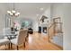 Bright living room featuring hardwood floors, a cozy fireplace, and staircase at 31139 Tahoe Ct, Evergreen, CO 80439
