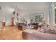 Comfortable living room featuring plush furniture, hardwood floors, and ample natural light at 31139 Tahoe Ct, Evergreen, CO 80439