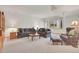 Spacious living room featuring carpet, two sofas, a side chair, and natural light from the window at 31139 Tahoe Ct, Evergreen, CO 80439