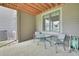 A covered patio featuring a table and chairs, perfect for outdoor dining and relaxation at 31139 Tahoe Ct, Evergreen, CO 80439
