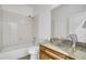 Bathroom featuring a glass vessel sink and tub with tile surround at 12317 W Gould Ave, Littleton, CO 80127