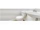 Clean half bathroom featuring a pedestal sink and toilet with efficient use of space at 12317 W Gould Ave, Littleton, CO 80127