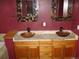 Bathroom with granite countertop with two wooden bowl sinks and square mirrors at 12317 W Gould Ave, Littleton, CO 80127