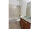 Bathroom with bathtub, shower, vanity with granite countertop, and a glass vessel sink at 12317 W Gould Ave, Littleton, CO 80127