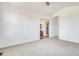 Large bedroom with a doorway to the bathroom and hallway at 12317 W Gould Ave, Littleton, CO 80127
