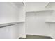 Walk-in closet with multiple levels of shelving and hanging rods at 12317 W Gould Ave, Littleton, CO 80127