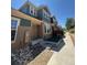 Townhouse with modern two-tone paint scheme and a tidy, landscaped walkway under a clear blue sky at 12317 W Gould Ave, Littleton, CO 80127
