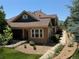 Exterior view of townhome featuring landscaped yard and a convenient access ramp at 12317 W Gould Ave, Littleton, CO 80127