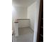 Cozy loft area with neutral carpet and bright white walls with a wooden banister at 12317 W Gould Ave, Littleton, CO 80127