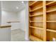 Loft featuring neutral carpet, and a built in bookshelf. The natural light creates a warm and inviting atmosphere at 12317 W Gould Ave, Littleton, CO 80127