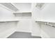 Bright, empty walk-in closet with shelving and metal bars for hanging clothes at 12317 W Gould Ave, Littleton, CO 80127