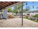 Inviting backyard patio with stone accents and outdoor seating, ideal for entertaining at 6761 Harlan St, Arvada, CO 80003