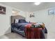 Comfortable bedroom with a well-lit window and stylish bed, perfect for relaxation at 6761 Harlan St, Arvada, CO 80003
