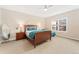 Inviting bedroom boasts a comfortable bed, side tables with lamps, and a large window for ample natural light at 8851 E 33Rd Ave, Denver, CO 80238