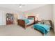 Bright bedroom with a sitting area, plush carpet, and coordinated furnishings, creating a comfortable retreat at 8851 E 33Rd Ave, Denver, CO 80238