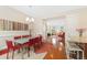 Open-concept dining room showcasing a contemporary table, chairs, and seamless transition to the adjacent living area at 8851 E 33Rd Ave, Denver, CO 80238