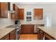 Well-lit kitchen with granite countertops and stainless steel appliances at 8851 E 33Rd Ave, Denver, CO 80238