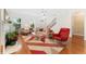 Bright living room with hardwood floors, ceiling fan, and a cozy seating area at 8851 E 33Rd Ave, Denver, CO 80238