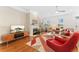 Living room with fireplace, hardwood floors and ample natural light at 8851 E 33Rd Ave, Denver, CO 80238