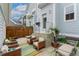 Outdoor patio featuring modern lounge chairs, a colorful rug, and access to the home at 8851 E 33Rd Ave, Denver, CO 80238