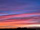 Colorful sunset view with vibrant clouds over city skyline at 8851 E 33Rd Ave, Denver, CO 80238