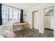 Bedroom featuring a study table by the windows and a closet in the corner at 1024 E 14Th Ave # 9, Denver, CO 80218