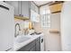 Efficient kitchen with stainless steel appliances, updated cabinets, and a bright natural light at 1024 E 14Th Ave # 9, Denver, CO 80218