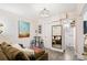 Open living area showcasing neutral paint, modern lighting, and views into the home's layout at 1024 E 14Th Ave # 9, Denver, CO 80218