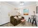 Cozy living room features modern lighting, neutral wall tones, and plush seating for comfortable living at 1024 E 14Th Ave # 9, Denver, CO 80218