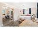 Cozy and cute main bedroom featuring lots of light and hardwood floors at 1024 E 14Th Ave # 9, Denver, CO 80218
