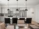 Modern kitchen featuring stainless steel appliances, backsplash and island with barstool seating at 9157 Rio Lado St, Littleton, CO 80125