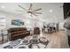Spacious living room featuring an open floor plan with modern furnishings and lots of natural light at 9157 Rio Lado St, Littleton, CO 80125