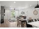Bright living room with an open floor plan, modern furniture, and sliding door to the patio at 9157 Rio Lado St, Littleton, CO 80125