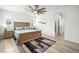 Relaxing main bedroom featuring a ceiling fan, a queen bed and lots of natural light at 9157 Rio Lado St, Littleton, CO 80125