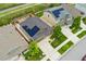 Aerial view of two houses with solar panels, showcasing neighborhood and landscaping at 15061 W 70Th Ave, Arvada, CO 80007
