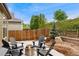 Private patio with modern fire pit and outdoor seating, creating an inviting space for relaxation and outdoor gatherings at 15061 W 70Th Ave, Arvada, CO 80007