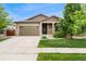 Charming single-Gathering home featuring a two-car garage and a well-manicured lawn, blending comfort and curb appeal at 15061 W 70Th Ave, Arvada, CO 80007
