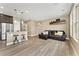 Open-concept living space features a stylish island with barstool seating, perfect for entertaining and everyday living at 15061 W 70Th Ave, Arvada, CO 80007