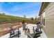 Cozy patio seating area with fire pit and seating, perfect for outdoor gatherings at 15061 W 70Th Ave, Arvada, CO 80007