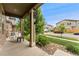 Front porch features rocking chair and views of the neighborhood at 15061 W 70Th Ave, Arvada, CO 80007