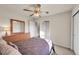 Bright bedroom with neutral carpet, ample natural light, and generous closet space at 11803 W Stanford Dr, Morrison, CO 80465