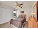 Comfortable bedroom with ceiling fan, natural light, and spacious closet at 11803 W Stanford Dr, Morrison, CO 80465