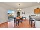 Bright dining area with hardwood floors, a sliding glass door, and an elegant chandelier at 11803 W Stanford Dr, Morrison, CO 80465