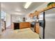 Well-lit kitchen features stainless steel appliances, light countertops and wood cabinets at 11803 W Stanford Dr, Morrison, CO 80465