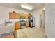 Well-lit kitchen featuring stainless steel appliances, stone countertops, and ample cabinet space at 11803 W Stanford Dr, Morrison, CO 80465